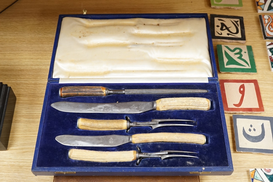 Four cased sets of silver plated flatware, including a carving set with antler handles, silver mounted.